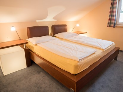 Stadthotels - Sauna - Österreich - Schlafzimmer - Penthouse mit Terrasse - Das Grüne Hotel zur Post - 100% BIO