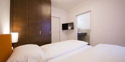 Stadthotels - barrierefrei - Österreich - Schlafzimmer - Ferienwohung "Stadtleben" - Das Grüne Hotel zur Post - 100% BIO