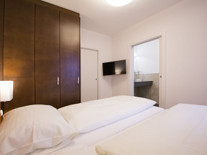 Stadthotels - Preisniveau: günstig - Schlafzimmer - Ferienwohung "Stadtleben" - Das Grüne Hotel zur Post - 100% BIO