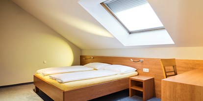 Stadthotels - Preisniveau: günstig - Österreich - Schlafzimmer - Penthouse mit Terrasse - Das Grüne Hotel zur Post - 100% BIO
