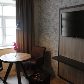 Hotel: Sitzbereich im Zimmer 36m²
TV 43 Zoll - Loft Collection Salzburg Mirabell 